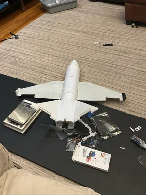 Fully assembled airframe with servos, wiring, and avionics laid out for integration
