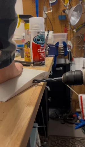 Drilling a mounting hole in a foam wing section on the workbench