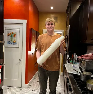 Holding the completed 3D-printed fuselage section after printing